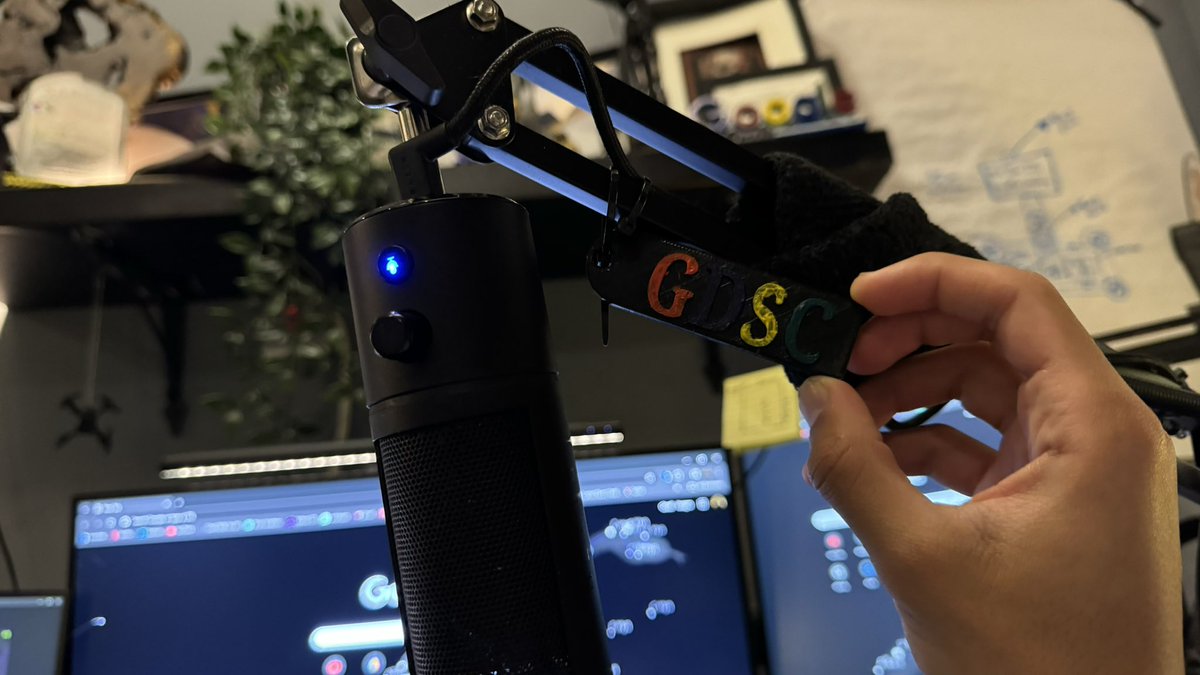 GDSC medal mounted on a microphone stand